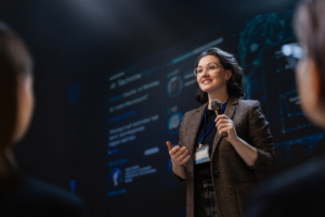 A high net-worth woman speaking at a conference showing confidence talking about long term goals